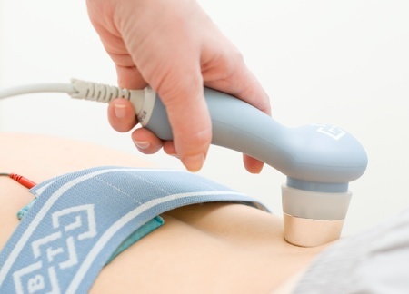 Therapeutic ultrasound by physiotherapist